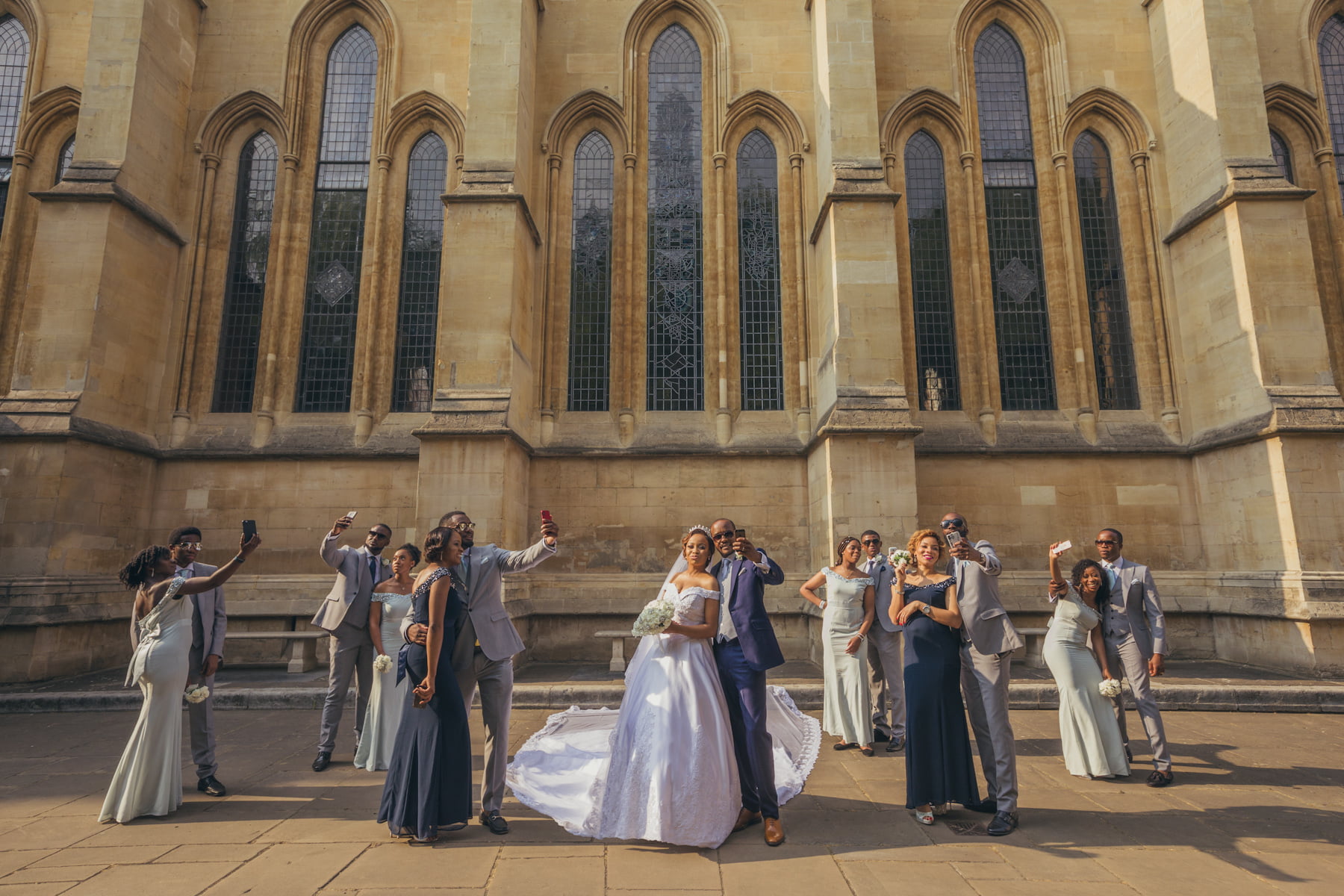 Selfie time for the bridesmaids and groomsmen with their beautiful British Nigerian couple's wedding couple photo shoot at The Honourable Society of the Inner Temple, Temple